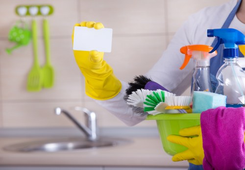 Cleaners following a health and safety policy in a professional setting