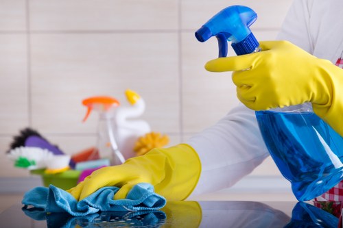 Cleaners applying safety procedures during routine cleaning work