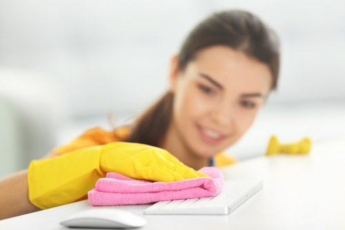 Professional cleaning of desks and shared office surfaces in SW2