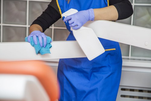 Cleaning a shared office kitchen and washroom area in SW2